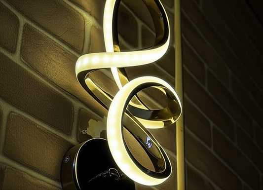 Modern light fixture with glowing white coils against a brick wall.